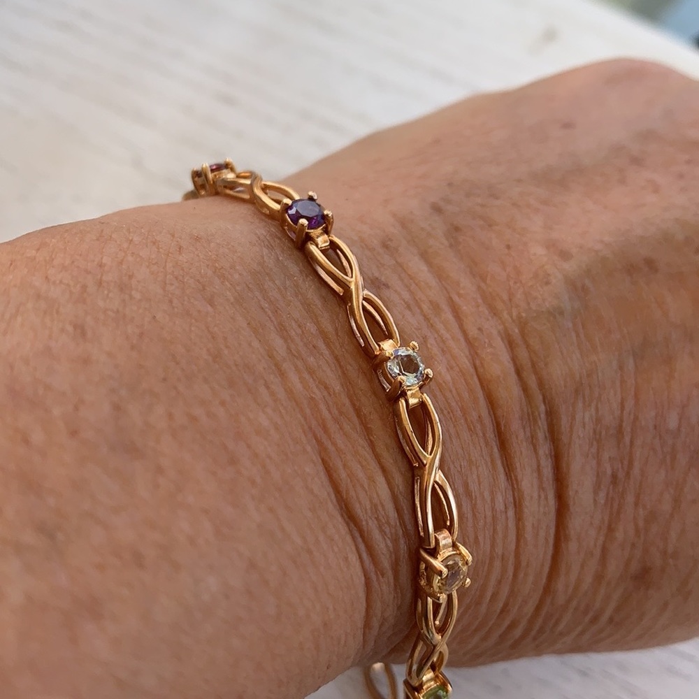 Goldtone bracelet with multicolored stones